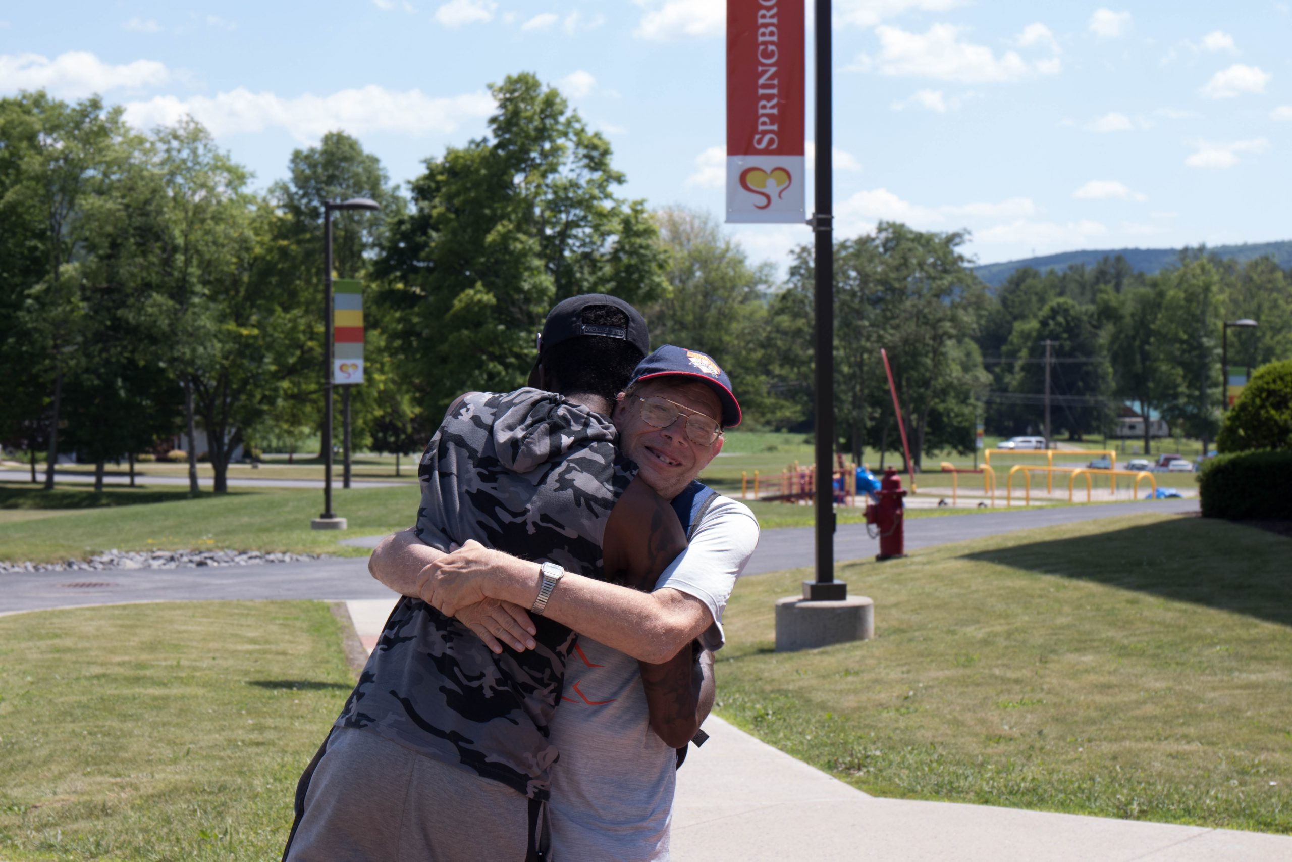 Photo6-3 | Springbrook Edward hugs coach Ray Williams